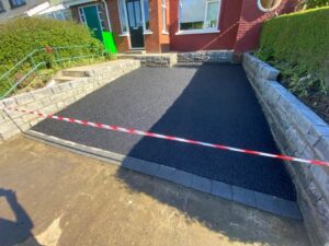 Asphalt driveway with Connemara walling completed 3