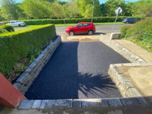 Asphalt driveway with Connemara walling completed 4