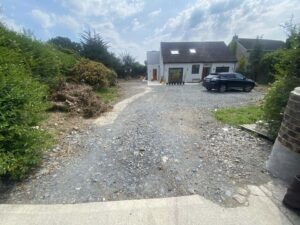 Tarmacadam driveway with kerbing and drainage