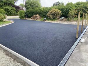 Tarmacadam driveway with kerbing and drainage10