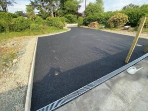 Tarmacadam driveway with kerbing and drainage8
